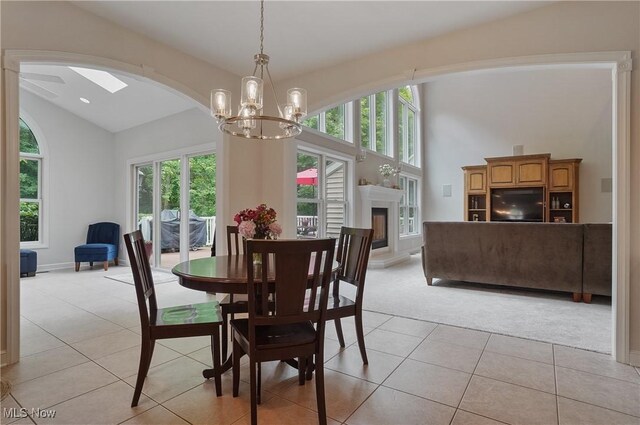 2634 Deer Ridge Run, Cuyahoga Falls, OH 44223 - dining space with vaulted ceiling, plenty of natural light, light carpet, light tile patterned flooring, and arched walkways