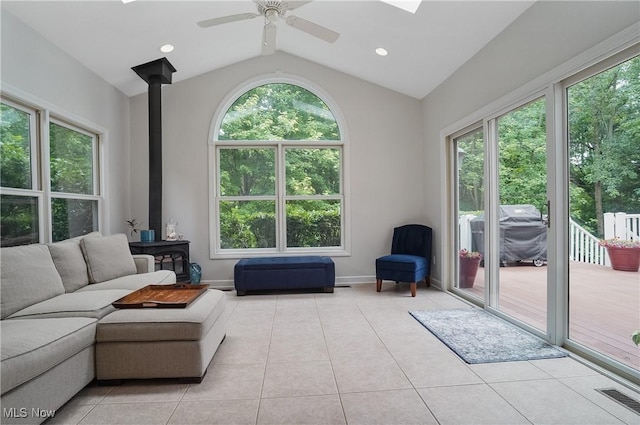 2634 Deer Ridge Run, Cuyahoga Falls, OH 44223 - living room with light tile patterned floors, lofted ceiling, ceiling fan, a wood stove, and recessed lighting