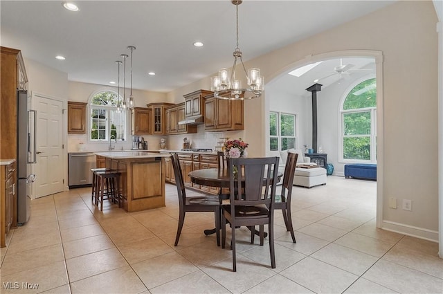 2634 Deer Ridge Run, Cuyahoga Falls, OH 44223 - dining space featuring a wood stove, recessed lighting, ceiling fan, a chandelier, and light tile patterned floors