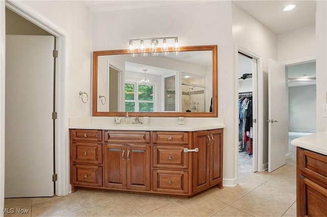 2634 Deer Ridge Run, Cuyahoga Falls, OH 44223 - full bathroom featuring vanity, a stall shower, tile patterned flooring, a spacious closet, and recessed lighting