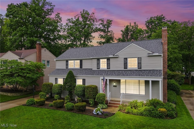 1120 Croyden Rd, Lyndhurst, OH 44124 - traditional-style home with roof with shingles, a front lawn, covered porch, and a chimney