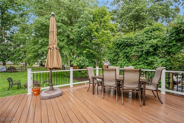 1120 Croyden Rd, Lyndhurst, OH 44124 - deck with outdoor dining space, a yard, and view of scattered trees