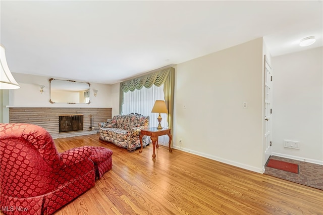 1120 Croyden Rd, Lyndhurst, OH 44124 - living area featuring wood finished floors and a glass covered fireplace
