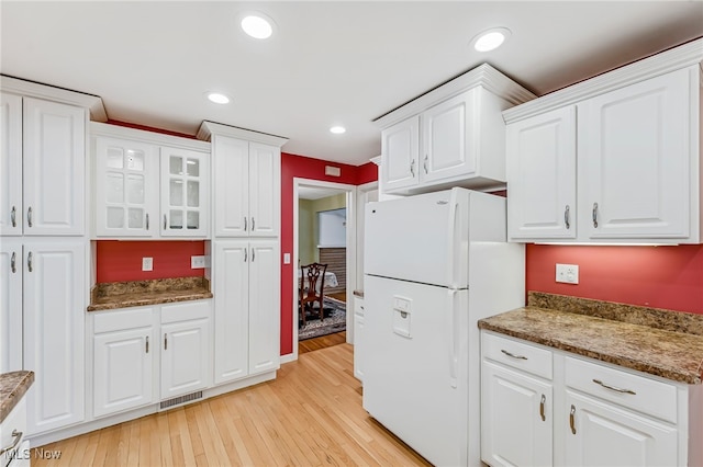 1120 Croyden Rd, Lyndhurst, OH 44124 - kitchen featuring freestanding refrigerator, light wood-style floors, white cabinetry, glass insert cabinets, and recessed lighting