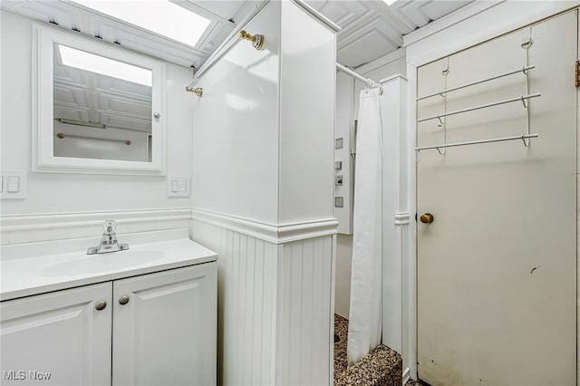 1120 Croyden Rd, Lyndhurst, OH 44124 - bathroom with vanity, a wainscoted wall, and curtained shower