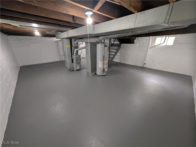 908 W 8th St, Lorain, OH 44052 - basement featuring gas water heater, stairs, and heating unit