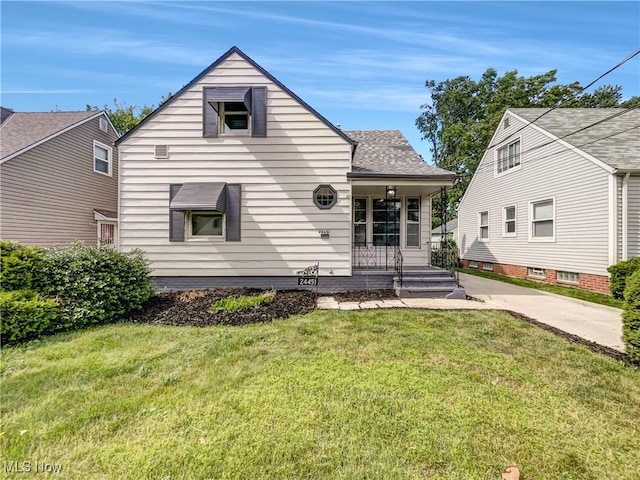 24451 Devoe Ave, Euclid, OH 44123 - bungalow featuring a front lawn, covered porch, and a shingled roof