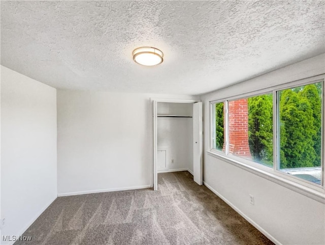 24451 Devoe Ave, Euclid, OH 44123 - unfurnished bedroom with carpet floors, a closet, and a textured ceiling
