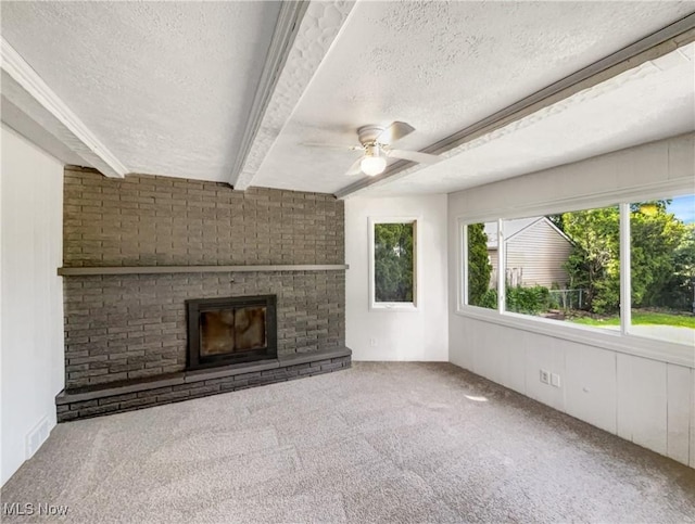 24451 Devoe Ave, Euclid, OH 44123 - unfurnished living room featuring a textured ceiling, carpet, a ceiling fan, a fireplace, and beamed ceiling