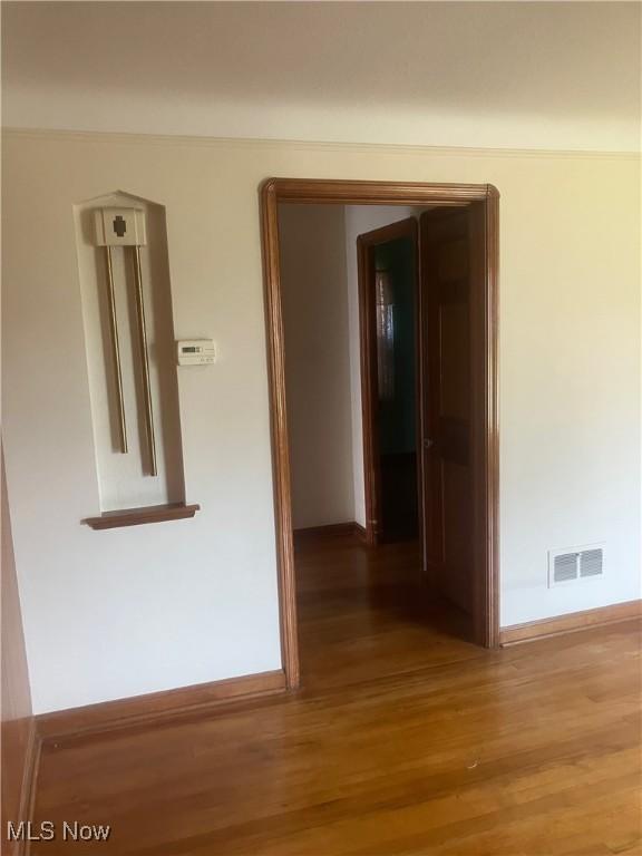 7718 Bertha Ave, Parma, OH 44129 - hallway featuring wood finished floors and baseboards