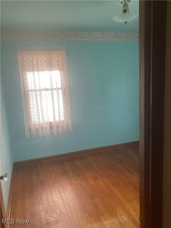 7718 Bertha Ave, Parma, OH 44129 - empty room with wood finished floors