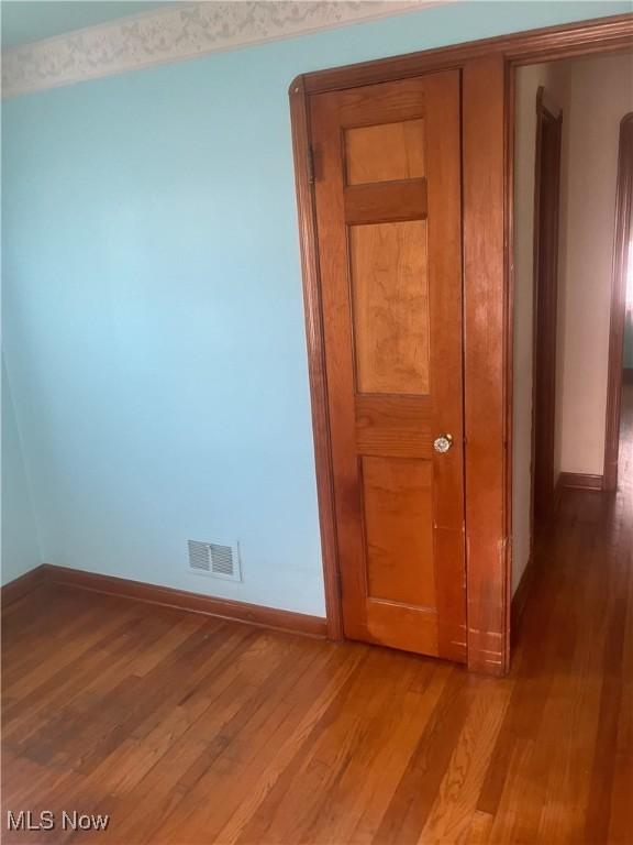 7718 Bertha Ave, Parma, OH 44129 - spare room with light wood-style flooring and baseboards