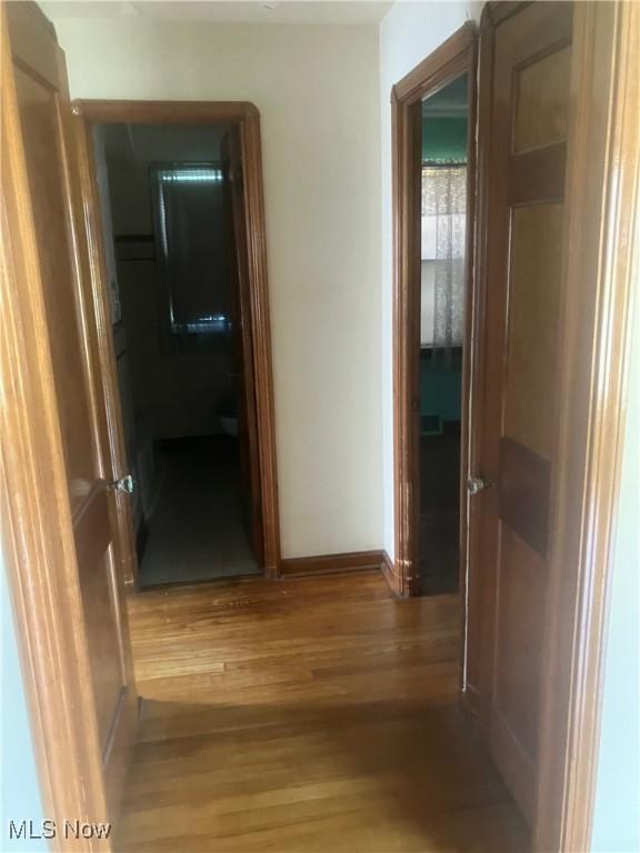 7718 Bertha Ave, Parma, OH 44129 - corridor with light wood-style floors and baseboards