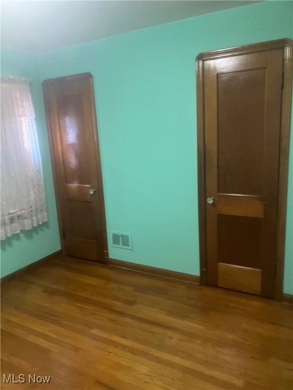 7718 Bertha Ave, Parma, OH 44129 - spare room featuring light wood-type flooring and baseboards