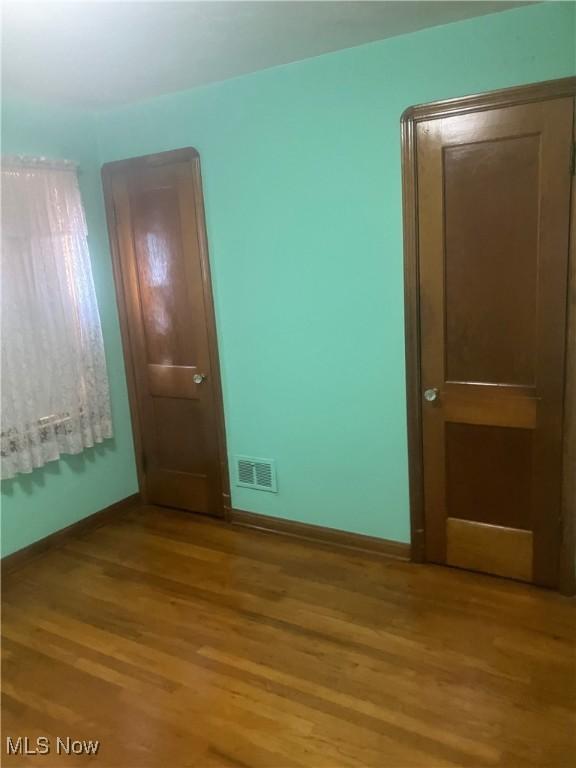 7718 Bertha Ave, Parma, OH 44129 - spare room with light wood-style flooring and baseboards