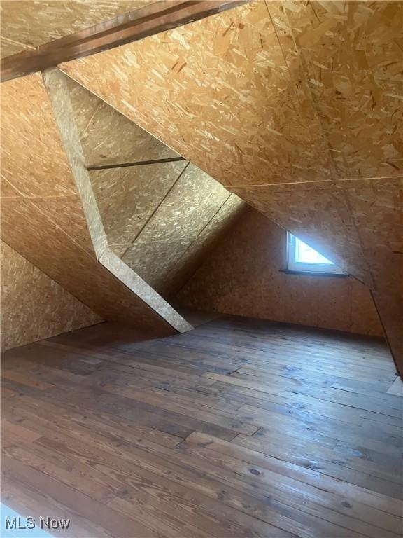 7718 Bertha Ave, Parma, OH 44129 - additional living space featuring dark wood-type flooring and lofted ceiling