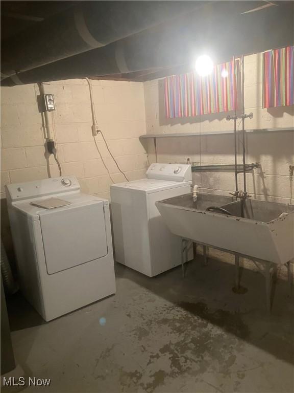 7718 Bertha Ave, Parma, OH 44129 - washroom with separate washer and dryer and concrete block wall
