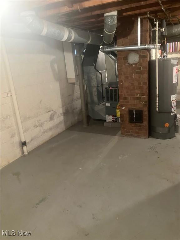 7718 Bertha Ave, Parma, OH 44129 - unfinished below grade area featuring gas water heater and heating unit
