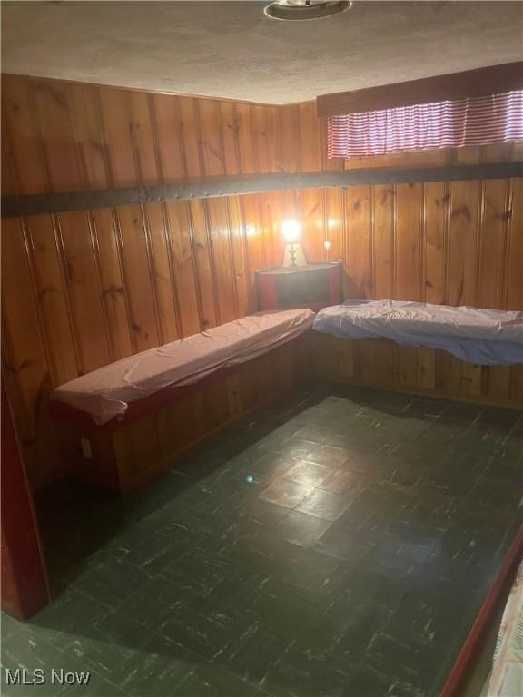 7718 Bertha Ave, Parma, OH 44129 - relaxing sauna / steam room featuring wooden walls and tile patterned floors