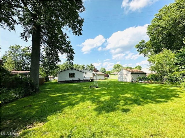 1684 Morris St, Mineral Ridge, OH 44440 - view of grassy yard featuring a shed