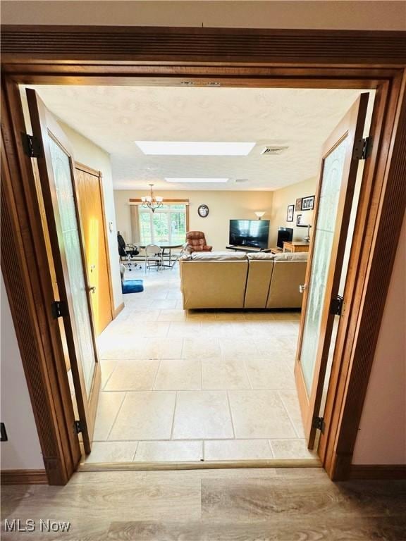 1684 Morris St, Mineral Ridge, OH 44440 - hallway featuring a chandelier