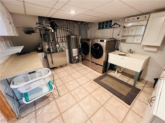 1684 Morris St, Mineral Ridge, OH 44440 - washroom with independent washer and dryer, gas water heater, and cabinet space