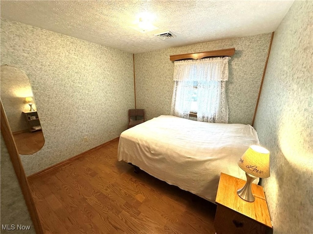 1684 Morris St, Mineral Ridge, OH 44440 - bedroom with wood finished floors and a textured ceiling