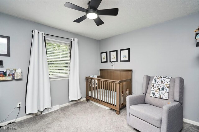 53 Joel Dr, Mogadore, OH 44260 - bedroom with carpet floors, a crib, and a ceiling fan