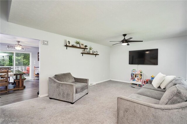 53 Joel Dr, Mogadore, OH 44260 - living room with a ceiling fan, carpet floors, and a textured ceiling