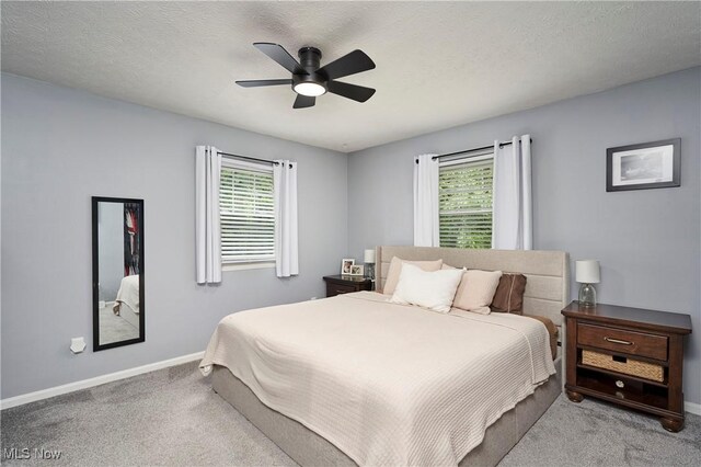 53 Joel Dr, Mogadore, OH 44260 - carpeted bedroom featuring multiple windows and ceiling fan