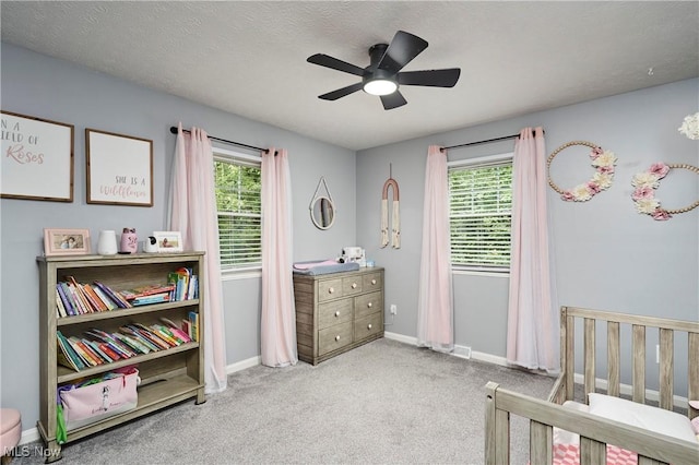 53 Joel Dr, Mogadore, OH 44260 - carpeted bedroom with multiple windows and ceiling fan