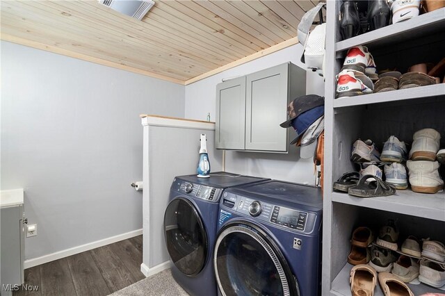 53 Joel Dr, Mogadore, OH 44260 - washroom with cabinet space, washer and clothes dryer, wood ceiling, and wood finished floors