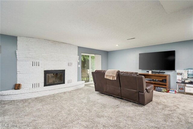 53 Joel Dr, Mogadore, OH 44260 - living room featuring carpet, a textured ceiling, and a fireplace