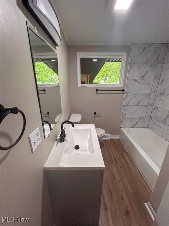 837 Pinecrest Rd, Girard, OH 44420 - full bathroom with wood finished floors, vanity, healthy amount of natural light, and shower / bathtub combination