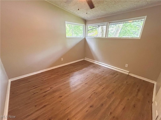 837 Pinecrest Rd, Girard, OH 44420 - unfurnished room featuring a textured ceiling, ceiling fan, wood finished floors, lofted ceiling, and a baseboard radiator