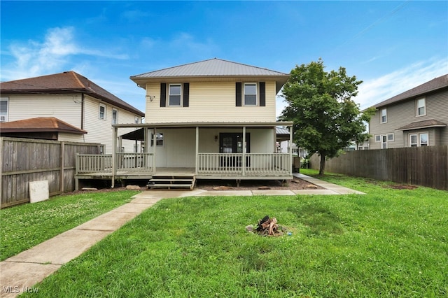 722 Clark St, Cambridge, OH 43725 - rear view of property featuring a fenced backyard, a metal roof, and a wooden deck