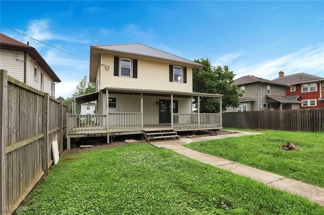 722 Clark St, Cambridge, OH 43725 - view of front facade with a fenced backyard, a metal roof, and a wooden deck