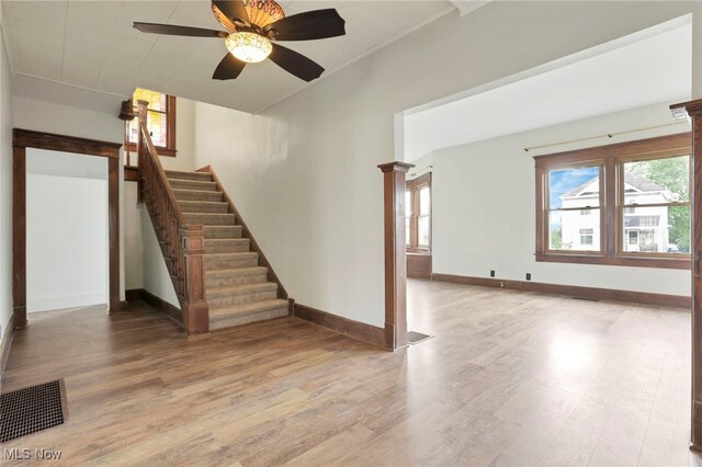 722 Clark St, Cambridge, OH 43725 - stairs with wood finished floors, healthy amount of natural light, and ceiling fan