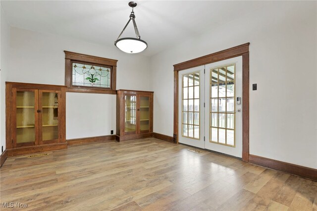 722 Clark St, Cambridge, OH 43725 - unfurnished room with light wood-type flooring and baseboards