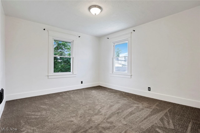 722 Clark St, Cambridge, OH 43725 - empty room featuring dark colored carpet