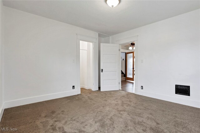 722 Clark St, Cambridge, OH 43725 - carpeted empty room with baseboards and a ceiling fan