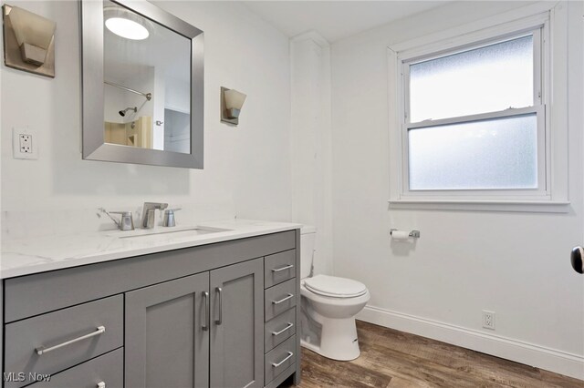722 Clark St, Cambridge, OH 43725 - full bath featuring vanity, wood finished floors, and a shower
