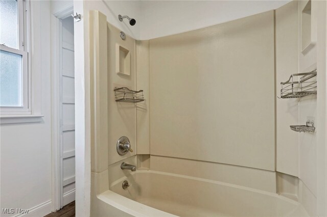 722 Clark St, Cambridge, OH 43725 - full bathroom with shower / bathtub combination and wood finished floors