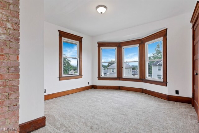 722 Clark St, Cambridge, OH 43725 - empty room featuring carpet and plenty of natural light
