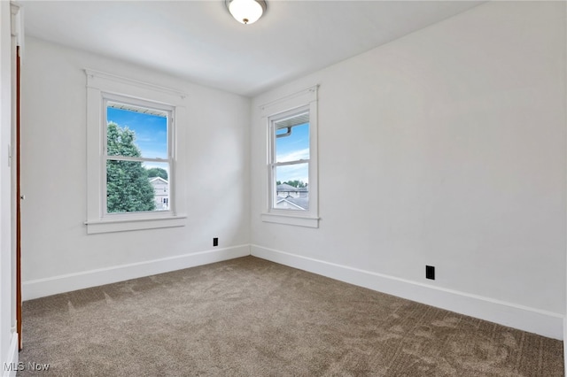 722 Clark St, Cambridge, OH 43725 - empty room with carpet and healthy amount of natural light