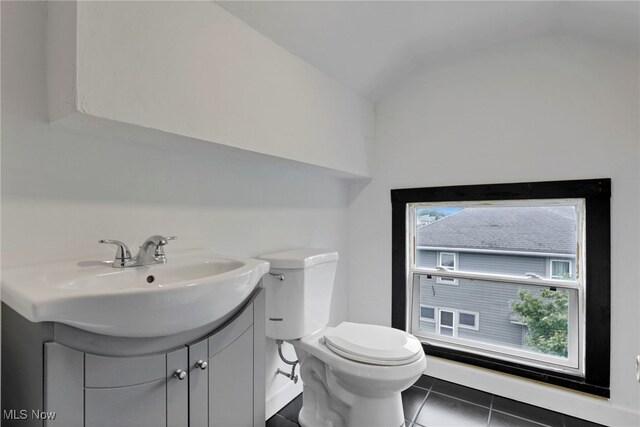 722 Clark St, Cambridge, OH 43725 - bathroom with vanity, tile patterned floors, and lofted ceiling