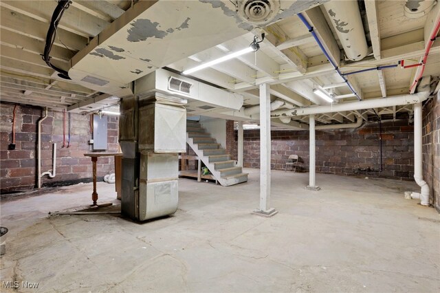 722 Clark St, Cambridge, OH 43725 - unfinished basement with stairway and heating unit