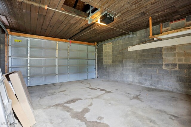 722 Clark St, Cambridge, OH 43725 - garage with a garage door opener and concrete block wall
