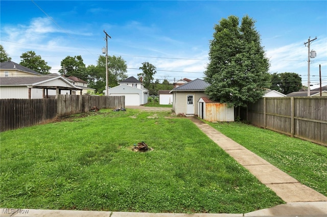 722 Clark St, Cambridge, OH 43725 - fenced backyard with a garage and a storage shed