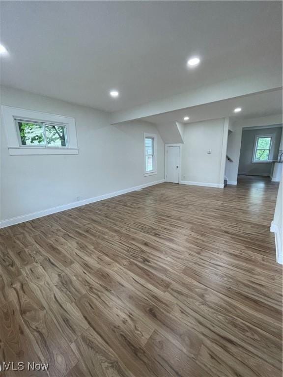 124 W 29th St, Lorain, OH 44055 - unfurnished living room with dark wood-style floors and recessed lighting